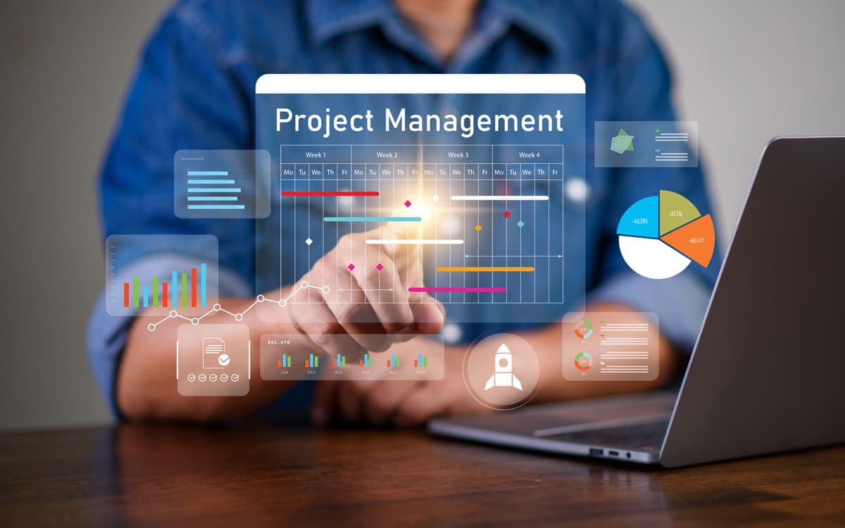 Project manager reviewing a digital project timeline and Gantt dashboard with progress charts