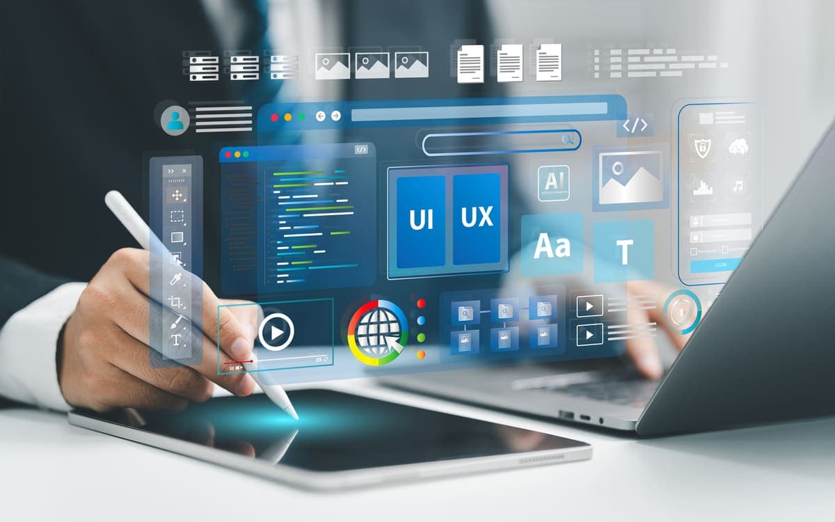 Designer building website UI and UX layouts with a stylus, surrounded by interface panels